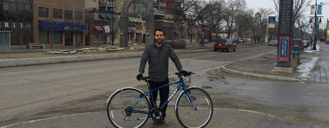 Stéphane Dorge with his bike on the Provencher Boulevard